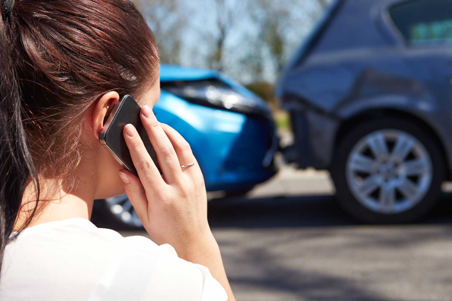 on-phone-after-car-crash-web on a cellphone after a car crash